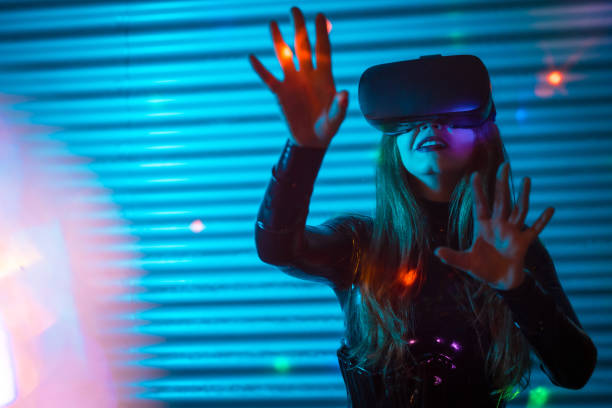 istock Young woman wearing augmented reality glasses touching screen with hands 1809737589