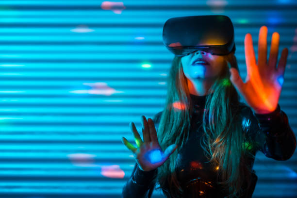 istock Young woman wearing virtual reality glasses touching screen with hands 1809737590