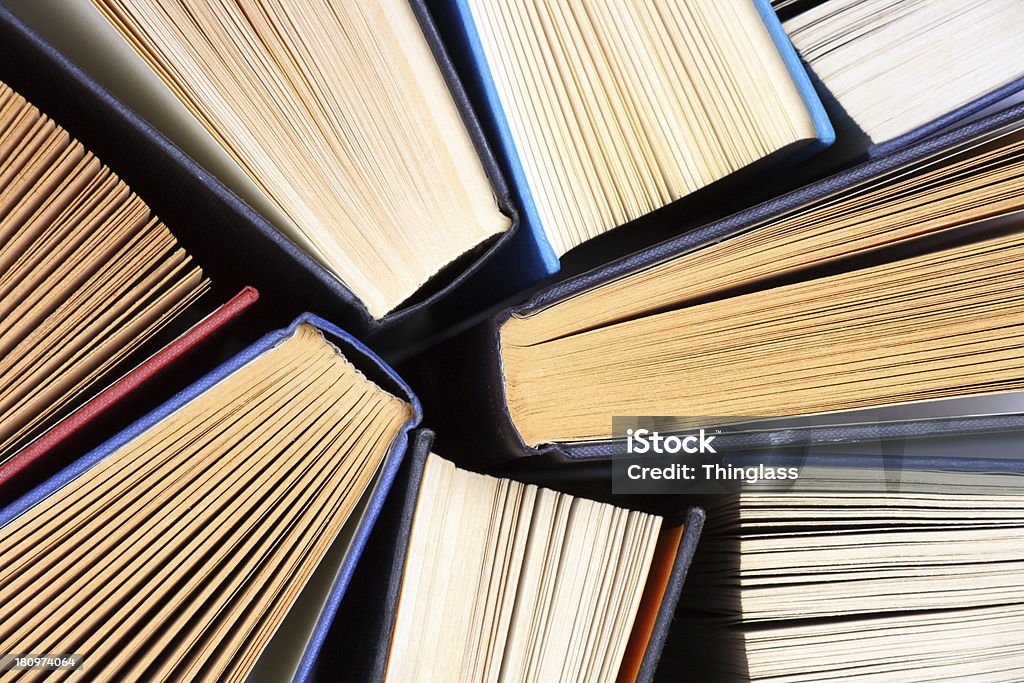 Old Hardback Books Hardback books or text books from above. Books and reading are essential for self improvement, gaining knowledge and success in our careers, business and personal lives  Above Stock Photo
