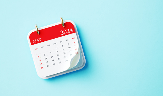May 2024 calendar on blue background. Directly above. Horizontal composition with copy space. Calendar and reminder concept.