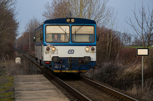 České dráhy (Czech Railways) small diesel train (Motorový vůz 811 model) arriving to Dobrovíz station