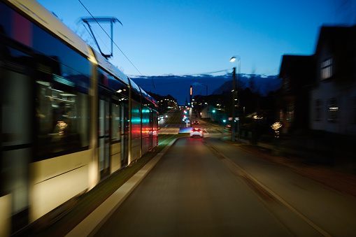 Driving alongside a tram in Odense at night. Long time exposure