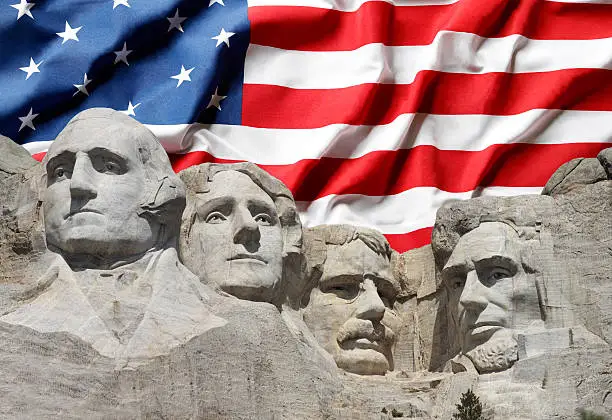 Photo of Mount Rushmore with American Flag Background