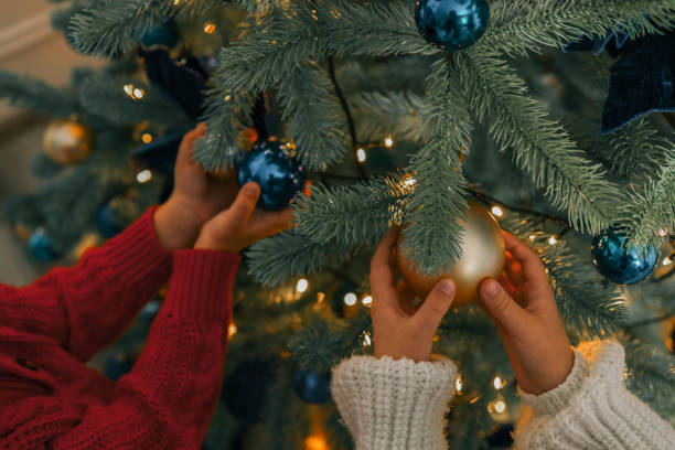 istock Children decorate Christmas tree, background 1809764305