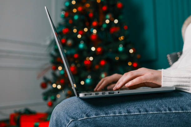istock Girl working with a laptop in a Christmas atmosphere 1809764716