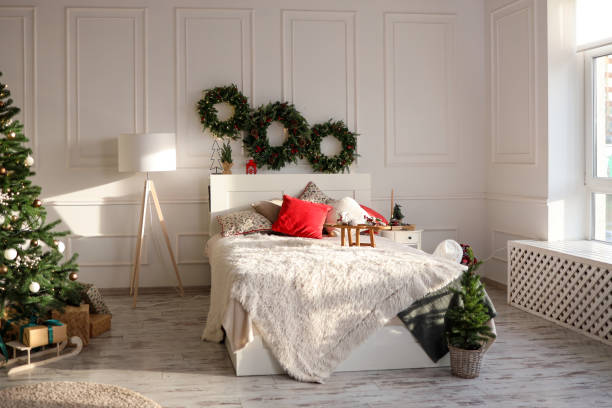istock Bed with New Year's decorations. New Year's interior. Christmas tree 1809770206