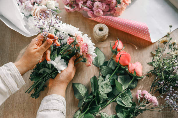 istock Florist at work. Woman making autumn floral decorations 1809773079
