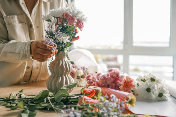 istock Florist at work. Woman making autumn floral decorations 1809773085