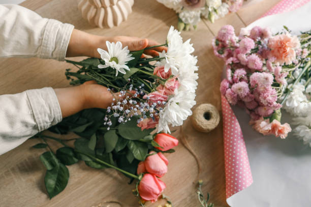 istock Florist at work. Woman making autumn floral decorations 1809773087
