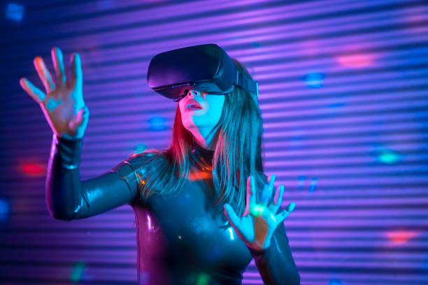 istock Female gamer wearing augmented reality goggles in a futuristic space 1809774189