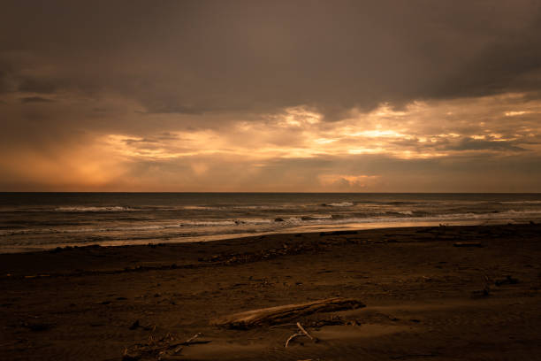 Sunrise at Costa Esmeralda Beach A cloudy sunrise on a Casitas beach in Veracruz. costa esmeralda stock pictures, royalty-free photos & images