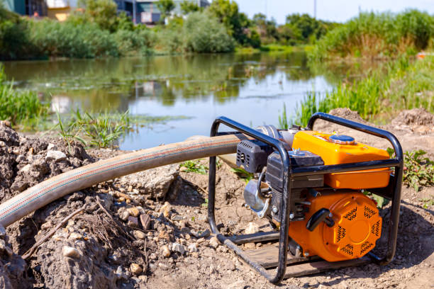 Water engine pump fills the cistern at construction site