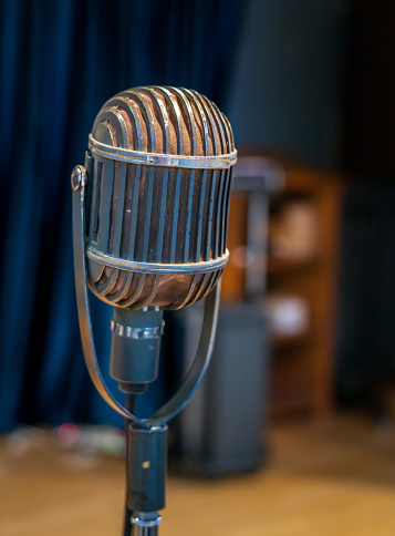 Old fashioned studio microphone on stage