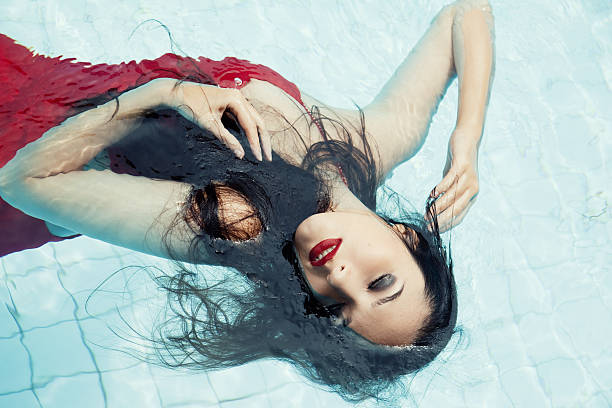 istock Woman in the pool 180979292