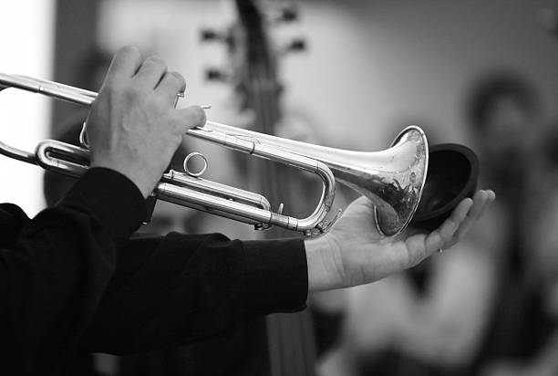 istock Musician hands playing the trumpet 180981586