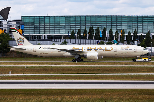 Munich / Germany - July 11, 2017: Etihad Airways Boeing 777-300ER A6-ETS passenger plane departure and take off at Munich Airport