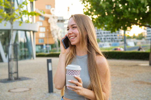 istock Young woman drinks coffee talking on phone with boyfriend 1809821032