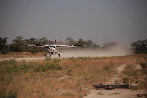 bush plane taking off on airstrip