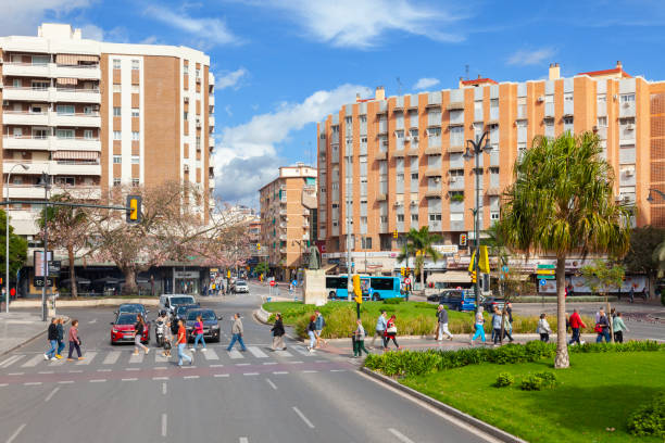 Pedestrians using a zebra crossing in central Málaga, Spain stock photo