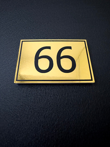 The entrance, distinguished by the bold numeral sign 66, stands out with its distinct and prominent marking.