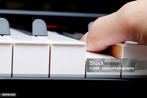 Finger On Piano Stock Photo - Download Image Now - Upright Piano, Arts Culture and Entertainment, Black And White