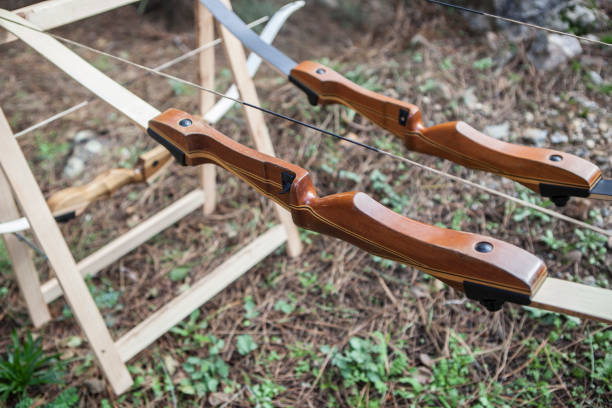 istock Wooden bows displayed over folding sawhorses 1809854766