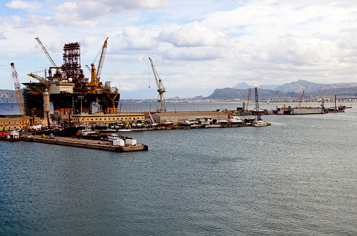 Palermo, Italy-October 26,2023: panoramic landscape view of Scarabeo 9 semi-submersible drilling vessel in dock of Palermo port. Vessel under renovation