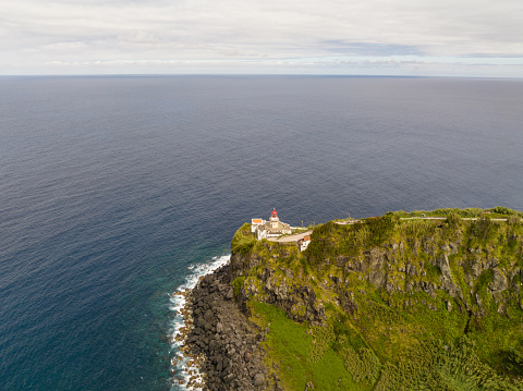 Farol do Arnel is a graceful lighthouse on Sao Miguel Island, Azores, guiding seafarers with its luminous presence and maritime history