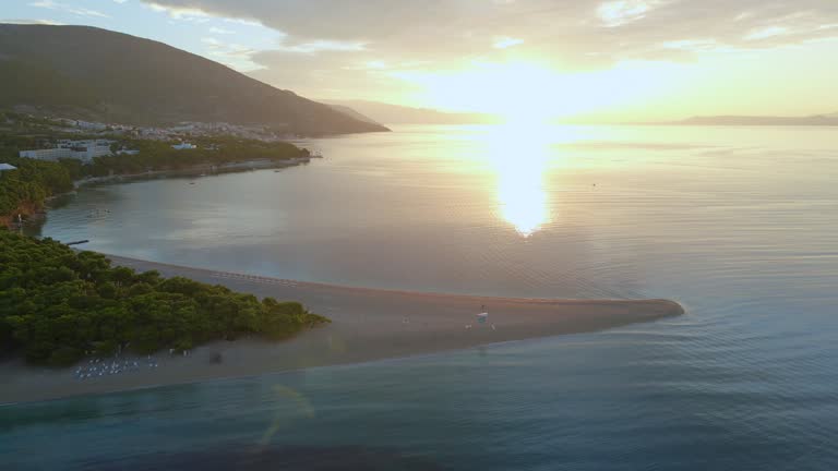 Zlatni Rat beach (Golden Horn beach) on Brac Island, Croatia at sunset, aerial