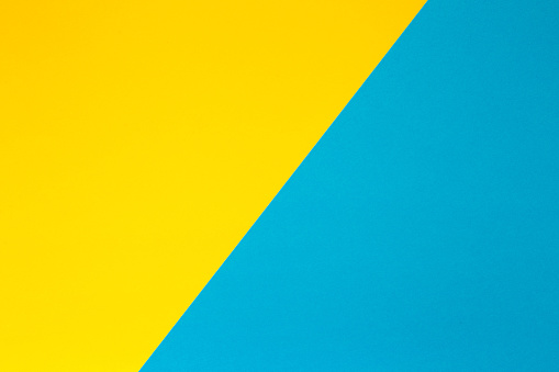 Yellow blue geometric paper background. Colorful bright background.