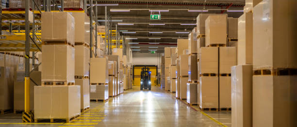 istock Warehouse worker driving forklift truck 1809919097