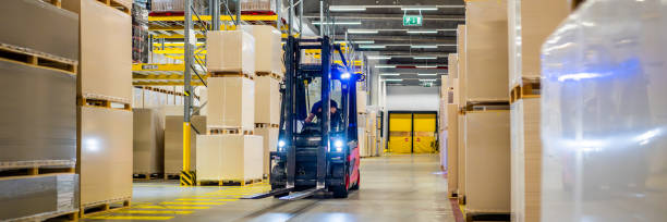 istock Warehouse worker driving forklift truck 1809919103