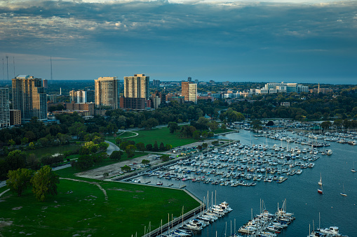 Aerial shot of Milwaukee, Wisconsin on a Fall evening, looking over sailboats in multiple marinas and Veterans Park towards the Lower East Side and Northpoint.