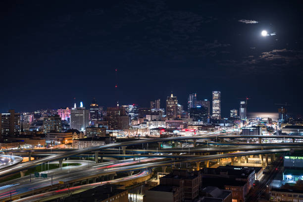 Aerial shot of downtown Milwaukee, Wisconsin at night, looking across the Marquette Interchange where I-44, I-94 and I-794 meet. \n\nAuthorization was obtained from the FAA for this operation in restricted airspace.