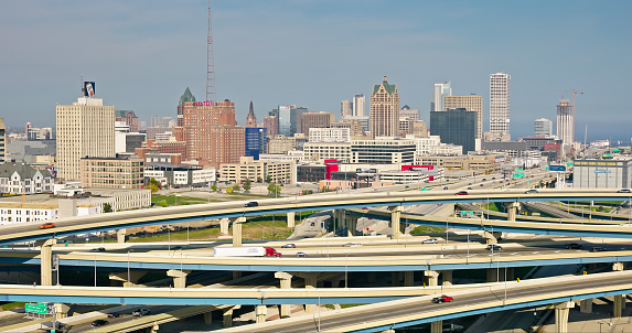 Aerial shot of downtown Milwaukee, Wisconsin on a hazy afternoon in Fall, looking across the Marquette Interchange where I-44, I-94 and I-794 meet. 

Authorization was obtained from the FAA for this operation in restricted airspace.