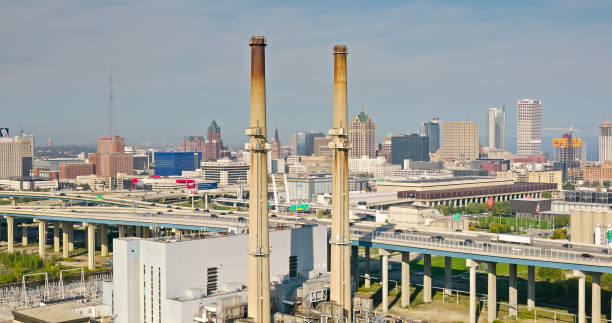 drone shot of power plant and freeway interchange in milwaukee - highway 94 fotografías e imágenes de stock