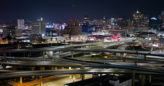 High angle drone shot of Marquette Interchange, where I-44, I-94 and I-794 meet, and downtown Milwaukee, Wisconsin at night. 

Authorization was obtained from the FAA for this operation in restricted airspace.