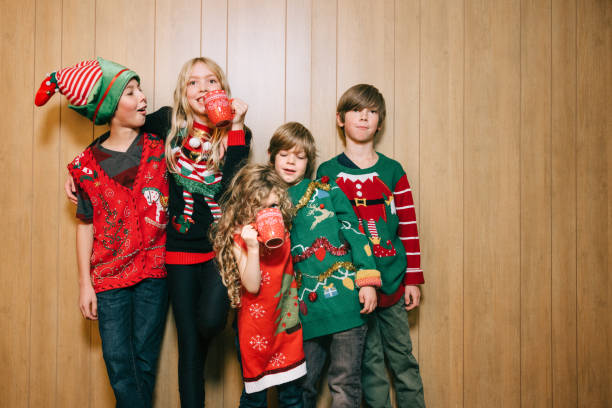 istock Group of Children With Ugly Christmas Sweaters 1809937384