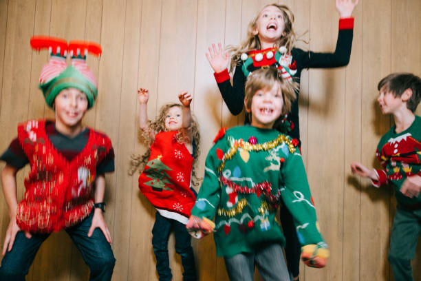 Group of Children With Ugly Christmas Sweaters