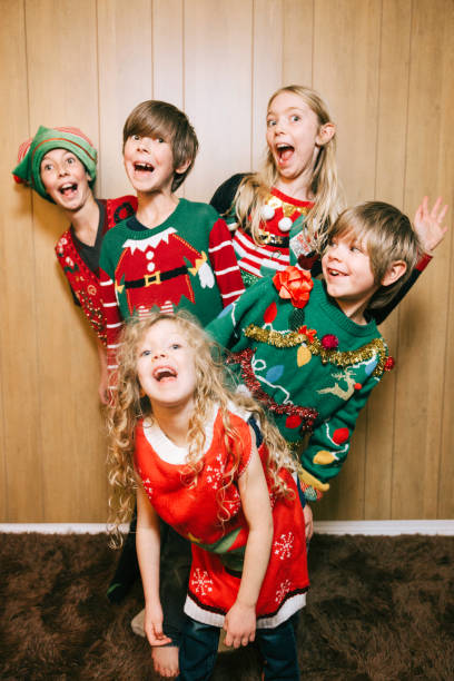 istock Group of Children With Ugly Christmas Sweaters 1809937388