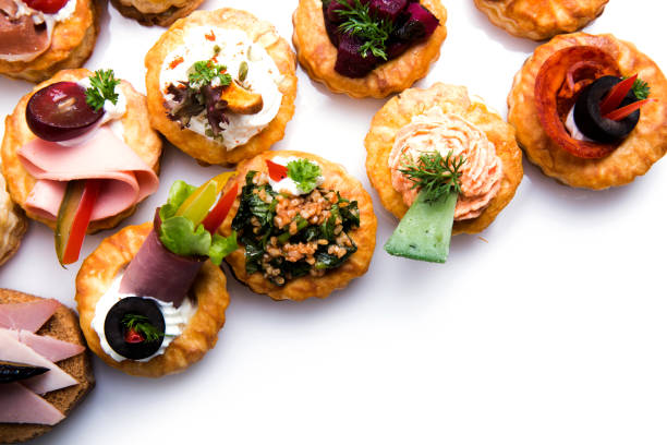 istock Different canapes with smoked salmon, cucumber cherry tomatoes and mozzarella 1809937638