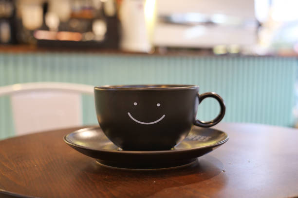 istock black coffee cup with smile shape design on it 1809942360