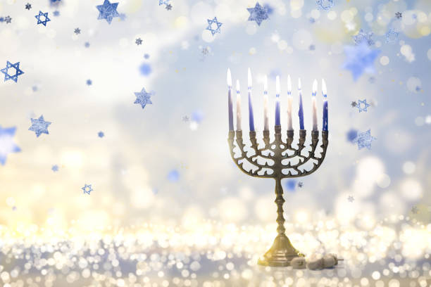 istock Happy Hanukkah. Candles lit in menorah. 1809944511