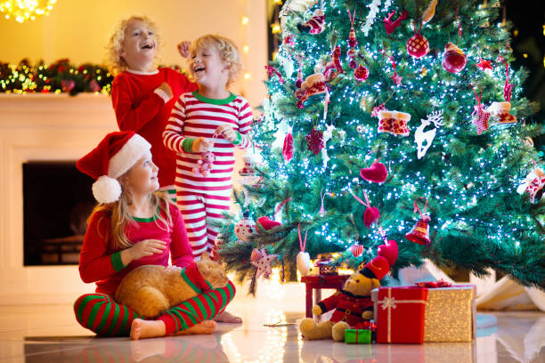 istock Child decorating Christmas tree. Kid on Xmas eve. 1809950064