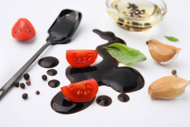istock Organic balsamic vinegar and cooking ingredients on white background 1809950606