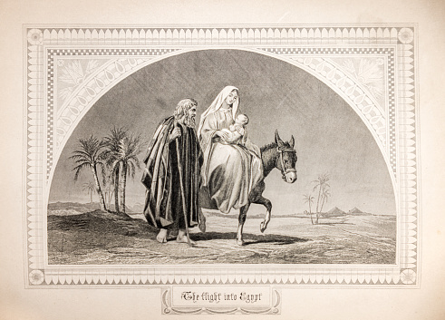 A print from an old 18th century Bible of the flight to Egypt from Bethlehem in the Christmas story, Mary riding on a donkey with the Christ child.  A key story in the Christian faith.