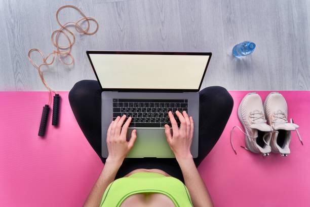 istock Sports online workouts at home gym using computer and sporty accessories. Mock up 1809954493