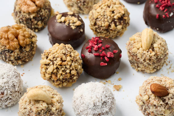 istock Set of round chocolate candies with nuts on a white background 1809955267