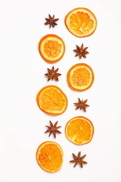 istock Dry orange slices and anise stars on white background, flat lay 1809960142