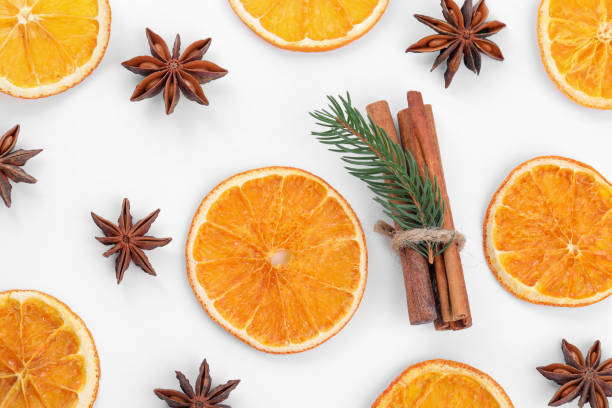 istock Flat lay composition with dry orange slices, anise stars and cinnamon sticks on white background 1809960734